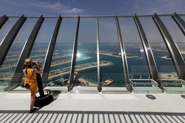 Soak in breathtaking views of Dubai's iconic coastline and luxurious landmarks from the Palm View Tower offering insights into the city's highlights and local gems.